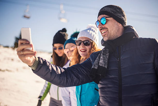 istock Group of friends having fun outdoors on winter day. 619734546