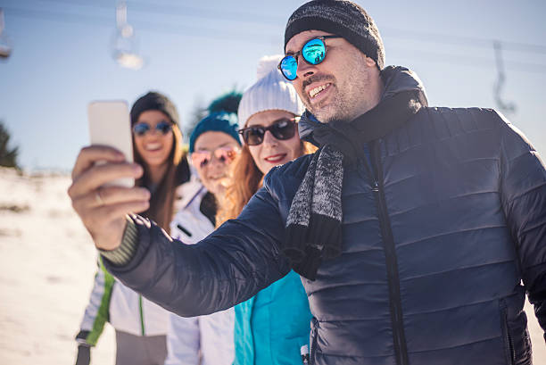 istock Group of friends having fun outdoors on winter day. 619734762