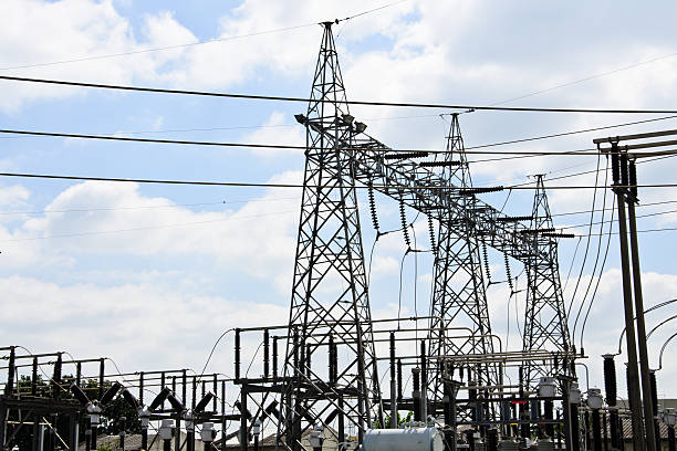 istock High voltage power lines with electricity pylons at blue sky. 619735366