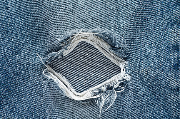istock .Denim jeans texture or denim jeans background with old torn. 619735558