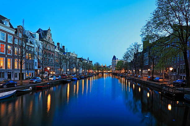 istock Canal Boat and Bridge at night, Amsterdam, Netherlands 619735982