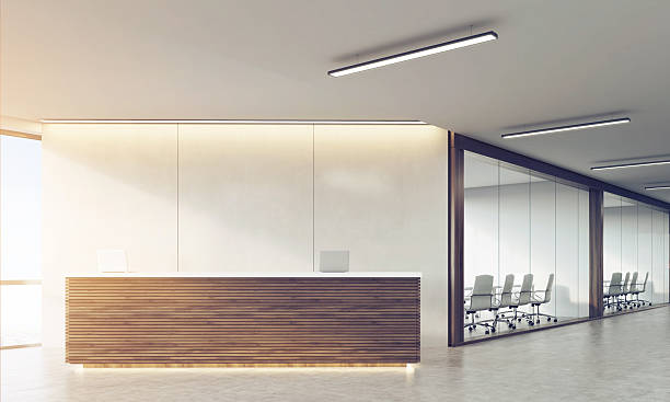 istock Front view of wooden sunlit reception counter 619736082