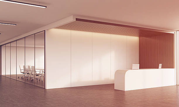 istock Reception desk and meeting room in sunlit corridor 619736312