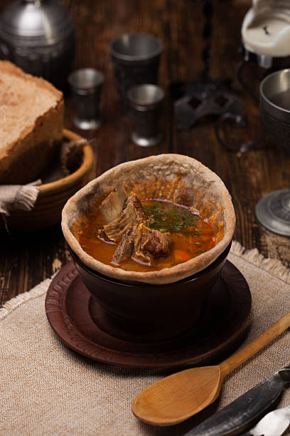 istock Traditional Ukrainian soup served in bread 619736408