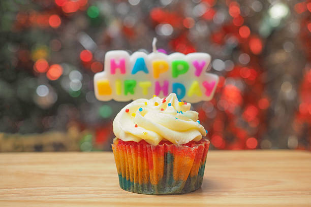 christmas cupcake with color lights at the background