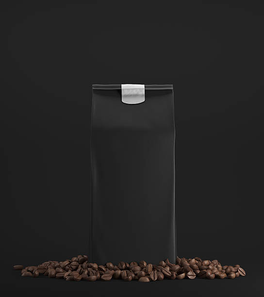 istock Black pack of coffee against black background 619737170