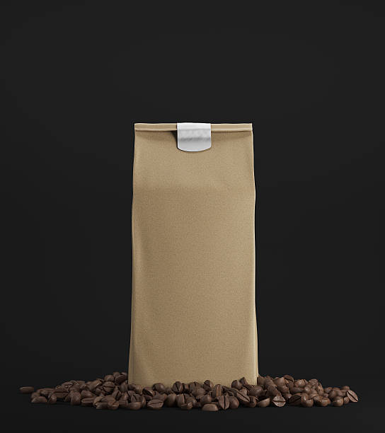 istock Beige pack of coffee against black background 619737250