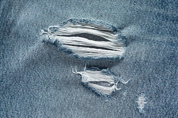 istock .Denim jeans texture or denim jeans background with old torn. 619737390
