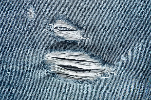 istock .Denim jeans texture or denim jeans background with old torn. 619737476