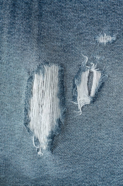 istock .Denim jeans texture or denim jeans background with old torn. 619738418