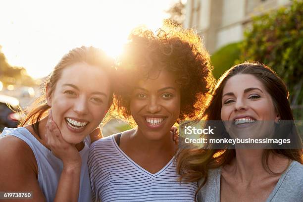 Portrait Of Three Young Adult Female Friends In The Street Stock Photo - Download Image Now
