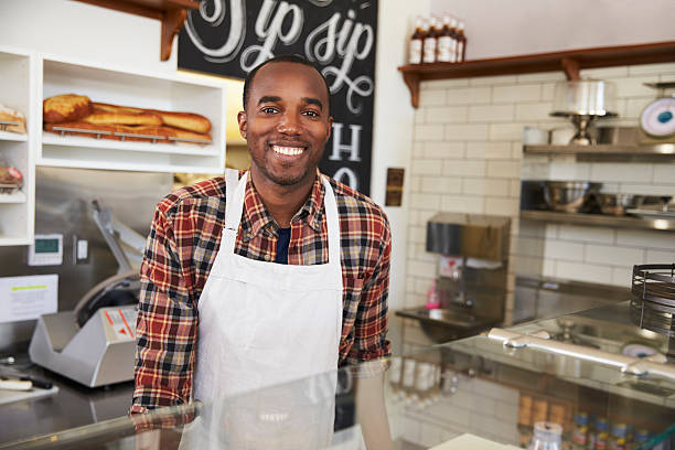 istock Business owner behind the counter at a sandwich bar 619738802