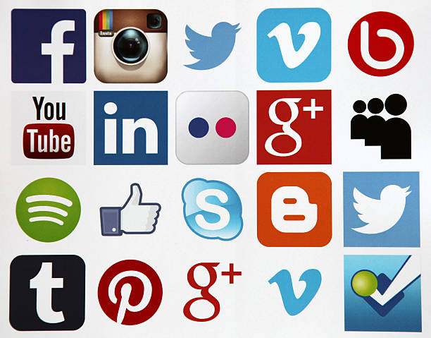 Berlin, Germany - July 16, 2015: Social media icons internet applications Facebook, Twitter, Instagram, Youtube, LinkedIn, Flickr, Google Plus, Spotify, Skype, Blogger, Tumblr, Pinterest etc. printed on white paper.