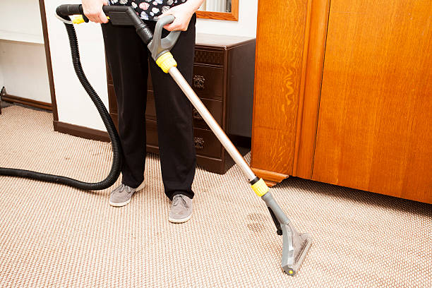 istock Woman using a Wet Carpet Washer 619741576