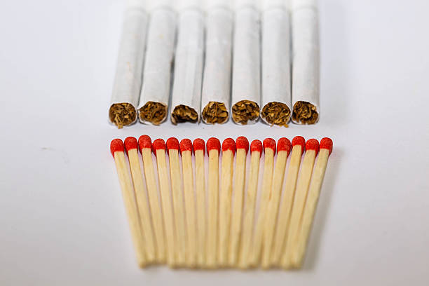 istock Matches are made from wood smoke white background. 619742164