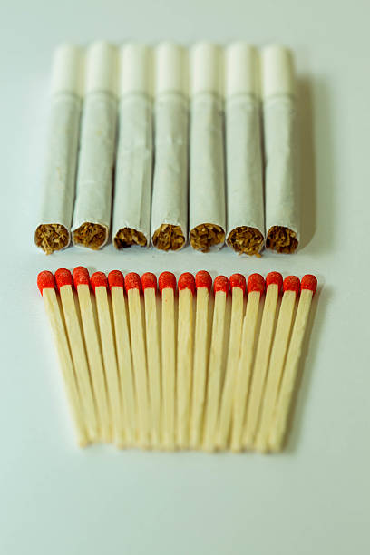 istock Matches are made from wood smoke white background. 619742176