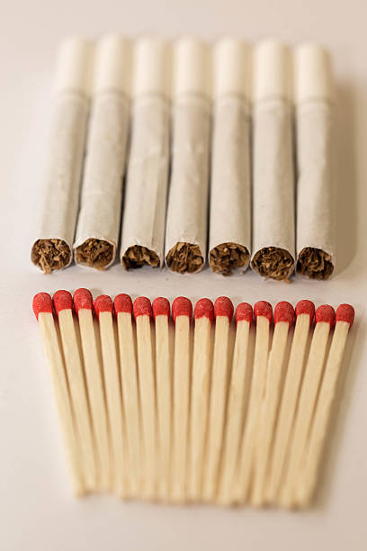 istock Matches are made from wood smoke white background. 619742188