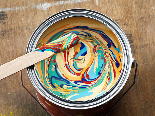 Color tin can on old wood background.