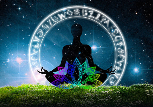 istock Yoga meditation sitting  on the grass under the night sky 619742776