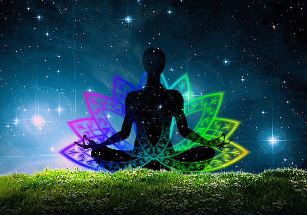 Yoga Meditation Sitting On The Grass Under The Night Sky Stock