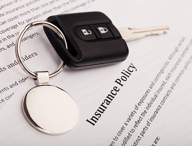 Insurance Car Key on an Insurance Policy car insurance photos stock pictures, royalty-free photos & images