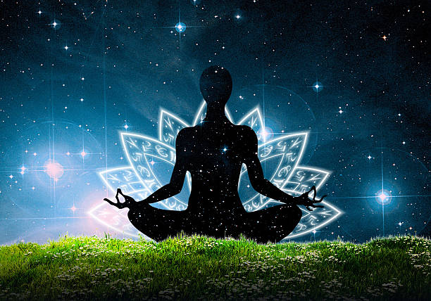 istock Yoga meditation sitting  on the grass under the night sky 619743308