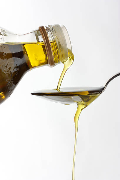 istock Pouring stream of vegetable oil 619746738