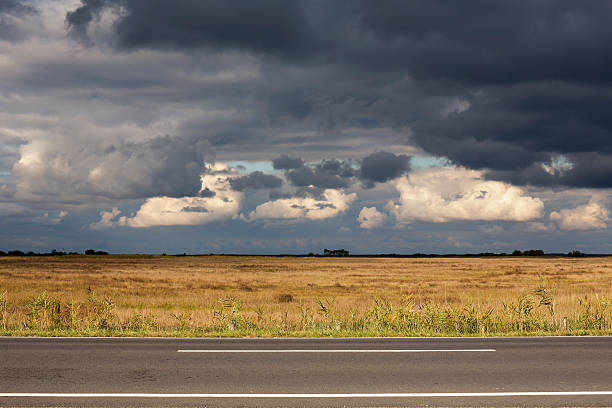 Stormy dark clouds gathering in the Hortobagy region of Hungary in autumn.