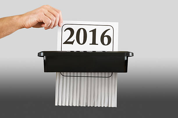 istock Destroying Year 2016 in a Paper Shredder 619747924