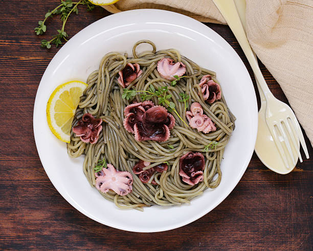 istock delicacy black pasta with cuttlefish sauce 619749978