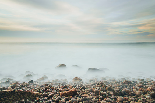 Some rocks emerging from the sea. Long exposure (30
