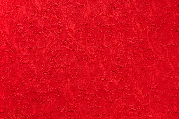 istock Red beautiful ornate paisley ethnic fabric. 619752600