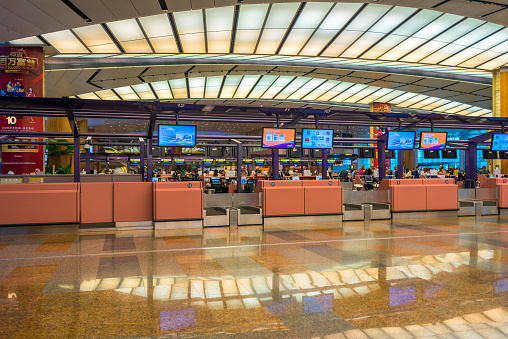 Singapore, Singapore - October 28, 2016: Departure hall at Changi airport with check-in zone and shop