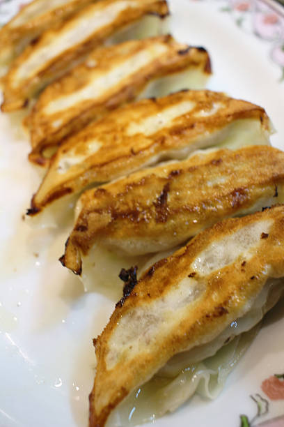 istock Asian appetizer menu fried dumpling or gyoza in japanese word 619753522