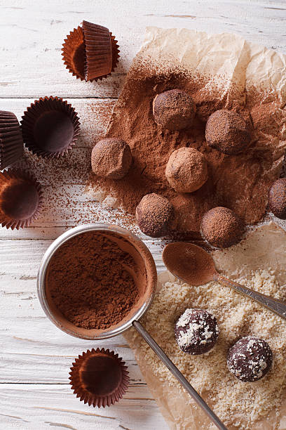 istock Preparation of chocolate truffles. vertical top view 619754410