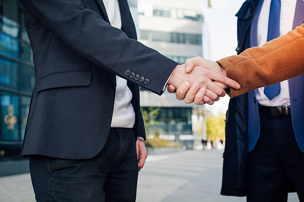 istock Business people shaking hands 619755480