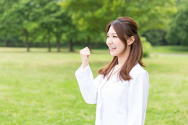istock Woman wearing lab coat 619757416