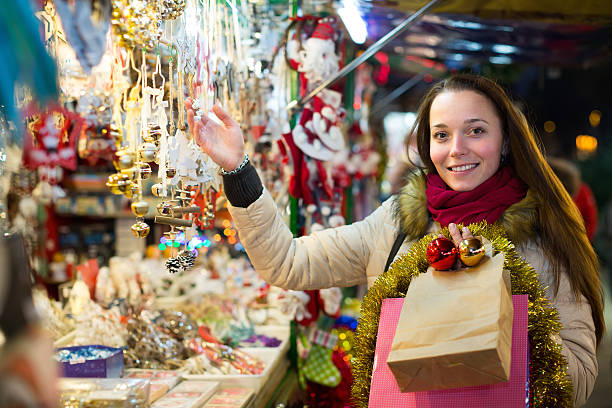 istock Woman at Christmas fair in evening 619757932
