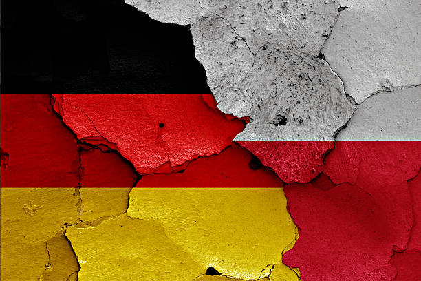 istock flags of Germany and Poland painted on cracked wall 619759020