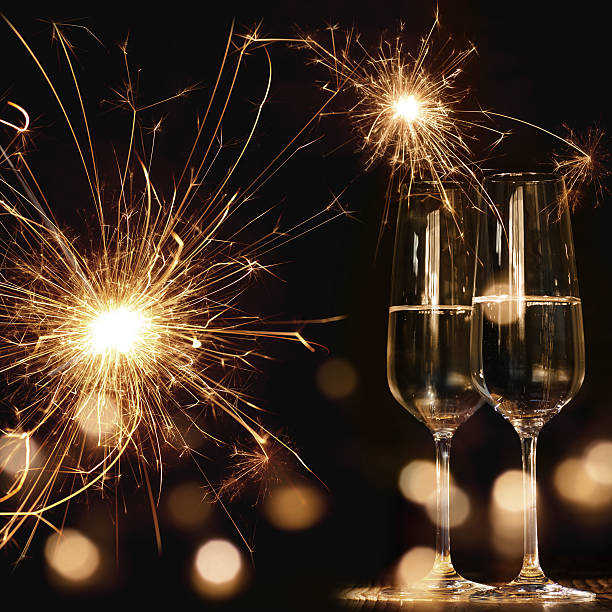 новогодний мотив с фейерверками и шампанским - stars in your eyes стоковые фото и изображения