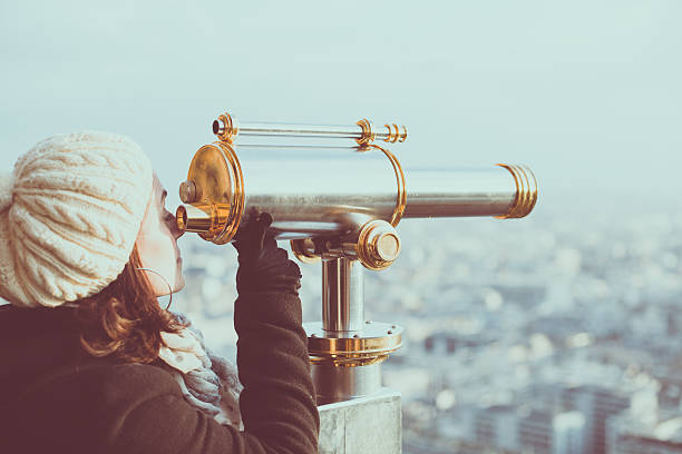 istock Young woman looks at Paris 619760376
