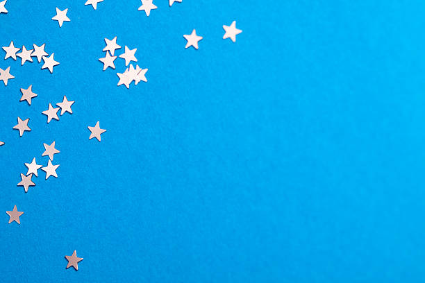 istock Frame of scatters little silver stars on blue background. 619760446