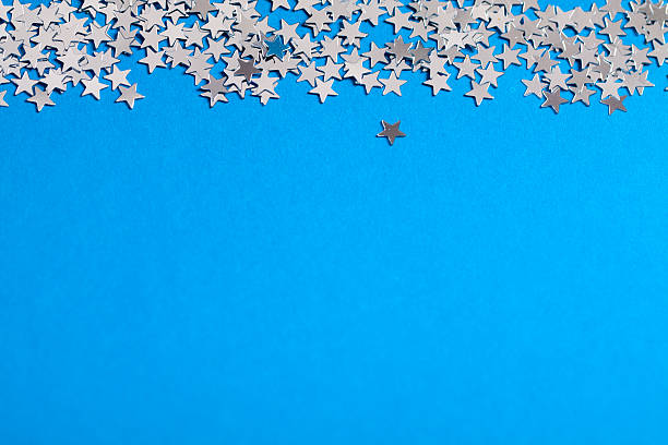 istock Frame of scatters little silver stars on blue background. 619760572