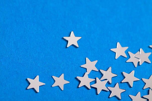 istock Frame of scatters little silver stars on blue background. 619760700