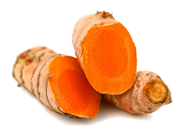 istock Cutting of turmeric roots isolated on white background 619761160