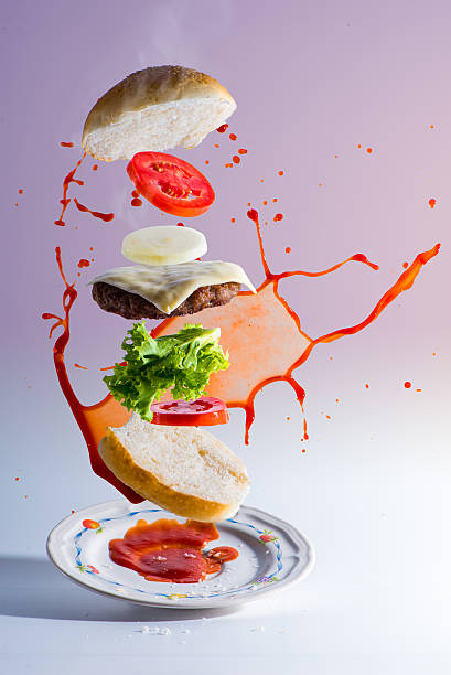 istock hamburger's ingredients float in mid air 619763952