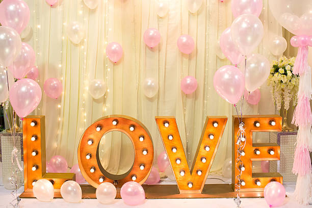 istock Luxury Indoors Wedding backdrop Decorate with word love light stand 619764794
