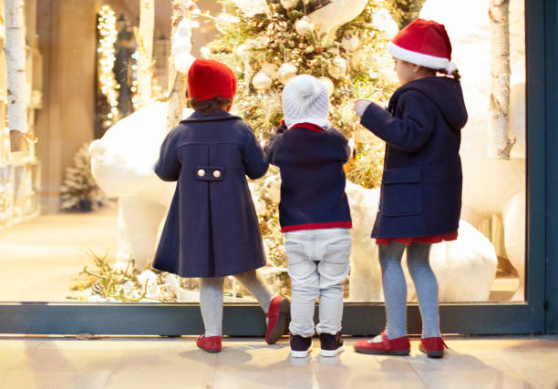 Children window shopping Children window shopping window shopping at night stock pictures, royalty-free photos & images