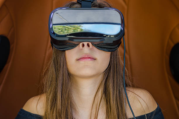 istock Girl playing game in virtual reality glasses 619765894
