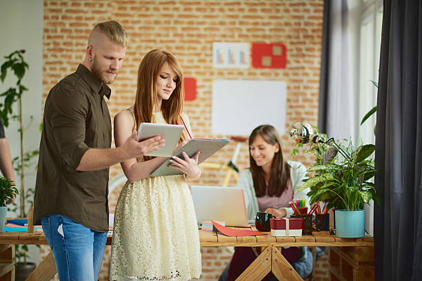 istock Group of Architects working in modern start up office 619767186
